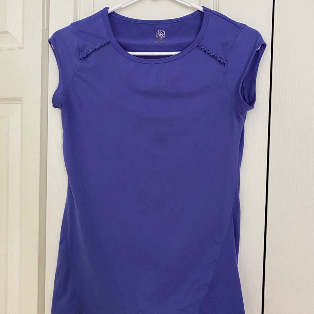 Cap sleeve purple workout shirt with ruffle detail.